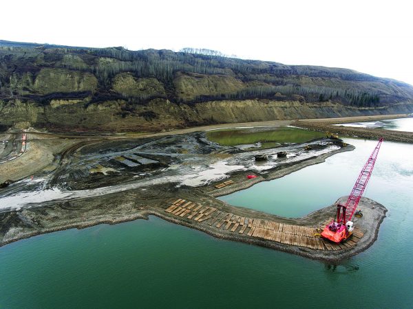 According to BC Hydro, construction work on the $10.7-billion, 1,100-megawatt Site C hydroelectric dam and generating station on the Peace River in northern British Columbia is moving ahead as planned. Pictured is in-river work taking place in April.