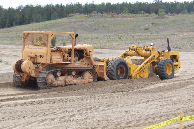 Owned and restored by Historical Construction Equipment Association of Canada (HCEA Canada) member James Dick, the Allis Chalmers HD 16 crawler equipped with a rare inside mount dozer blade that makes it ideal for push loading scrapers is pushing a 1950's era LeTourneau model D scraper, which is powered by a 4-71 GM diesel and is one of two units owned and restored by Bob and Doug Davis.