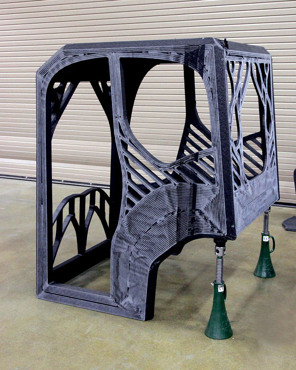 Project AME focused on the excavator’s operator cab, hydraulic arm and heat exchanger. The cab was printed on the Cincinnati Incorporated Big Area Additive Manufacturing system in five hours using carbon fibre-reinforced ABS plastic.