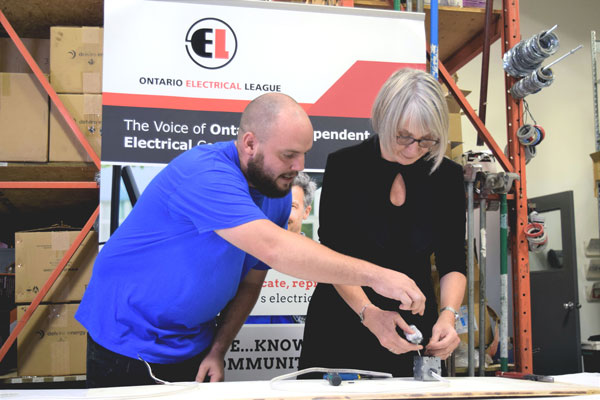 Ian Currell, an electrical apprentice in his fourth year of training, now working at Corlan Electric of Mississauga, challenged federal Minister of Employment, Workforce Development and Labour Patty Hajdu to perform a workshop task at a media event held Sept. 21.