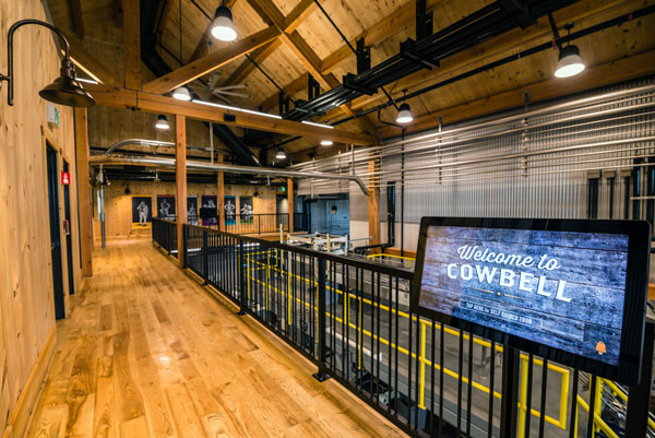 The timber-frame structure is visible throughout the interior of the Cowbell Brewing Co. facility in Blyth, Ont. The project won the Environmental Building Award in the 2018 Ontario Wood WORKS! wood design awards program.