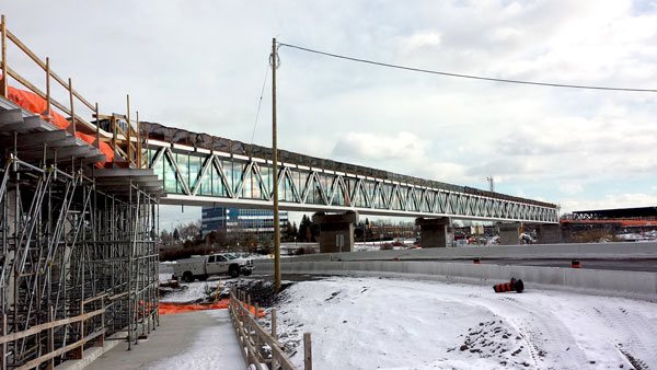 Construction of the stairs and ramp proceeded at the Coventry pedestrian footbridge during an earlier phase of the Ottawa LRT build.