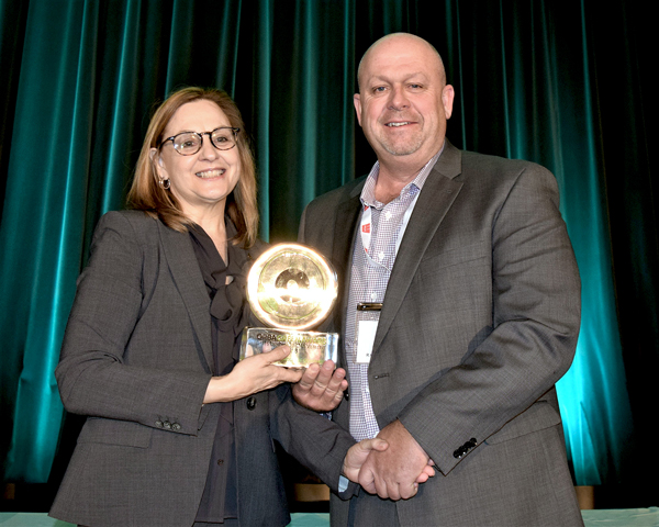 Russ Perry, vice-president of heavy civil at Tomlinson Group of Companies, accepted the ORBA Green Leadership and Sustainability Award from outgoing ORBA president Marlene Yakabuski.