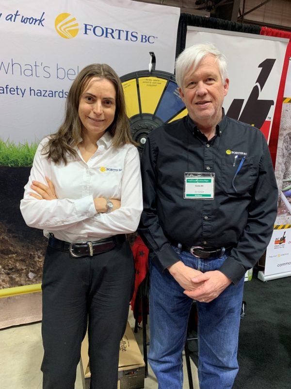 FortisBC manager of damage prevention and emergency services Ian Turnbull explained the procedures and potential peril involving the company’s underground gas pipeline network to an audience of builders at the fourth annual Construction Expo in Cloverdale, B.C. From left, FortisBC public safety manager Michelle Petrusevich poses with Turnbull at a booth during the expo.