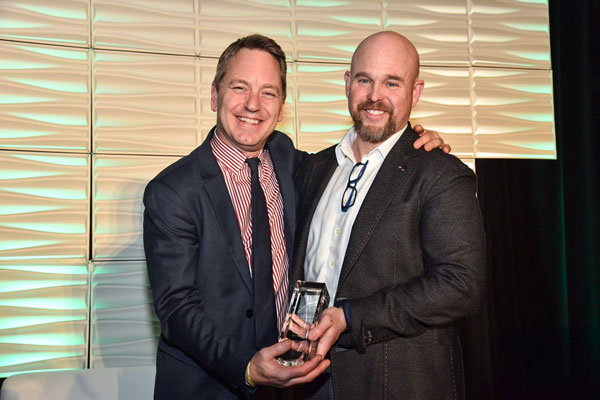 Sean Mason (right) of Sean Mason Homes accepted an EnerQuality Hall of Fame award from Corey McBurney, president of EnerQuality.