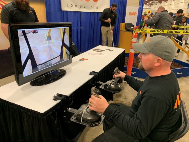 International Union of Operating Engineers instructor Andy Coles demonstrates a virtual reality simulator designed to teach secondary students about operating heavy machinery at the Skills Canada BC competition, held April 17 in Abbotsford, B.C.
