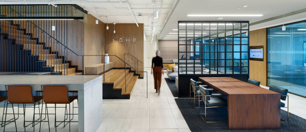 In order to create opportunities for employers to engage in casual collisions and stay connected, BentallGreenOak installed a staircase from the 12th to the 11th floor at its new offices at One York in Toronto, with the landing area near the reception area featuring casual meeting places near the coffee machine.