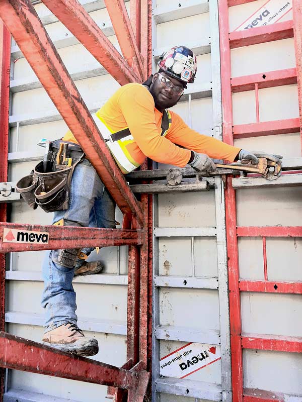 Kemar Clark, employed by Outspan Concrete Structures Ltd., is working on the Crosstown’s new Kennedy Station project and is part of a crew forming walls and slabs. He believes the project has been a magnet for young carpenters thus far.