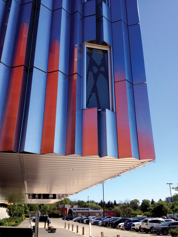 The sloping roof areas of the Sheridan College campus building in Brampton, Ont. were completed using a watertight standing-seam insulated metal panel system. The visually-appealing panels have insulated foam in-between and the joints are caulked.