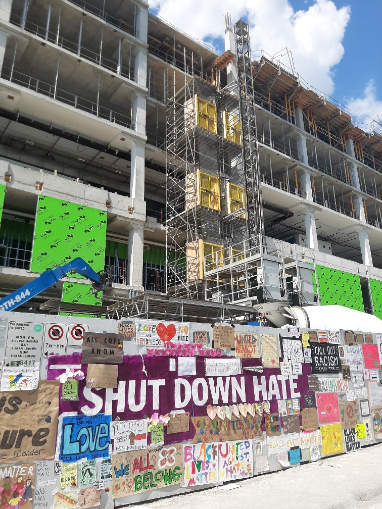 Posters surround a large message that says “Shut Down Hate” at the Michael Garron Hospital construction site. This comes after a noose was found by workers at the site on June 10.