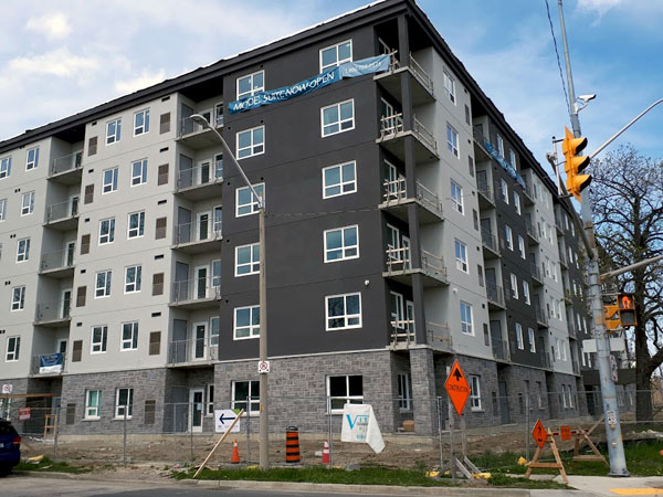 Pictured is the exterior of West Bridge Place in central Windsor, Ont., which is slated to be finished later this summer. It is the first highrise residential tower in the city’s centre in three decades.