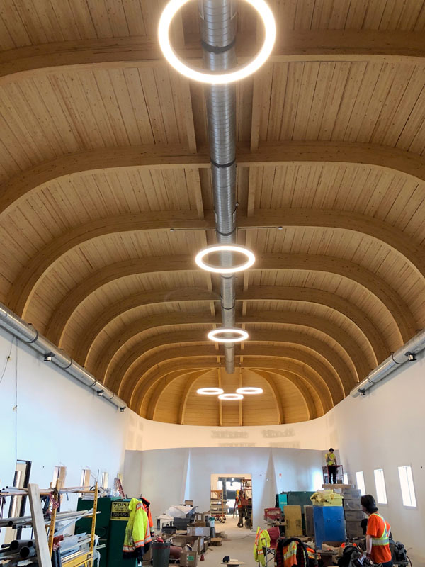 A barrel-vault timber roof is one unique feature of the Anishinabek Discovery Centre, which is set to open this July in Sault Ste. Marie, Ont. The roof, by Timber Systems Limited, is comprised of large exposed glue-laminated timbers, a wood deck and two parallel beams.