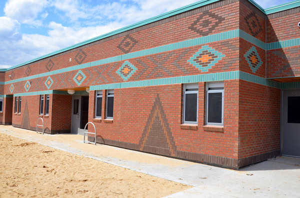 One of the structures, a school, designed by Saskatchewan architect Heney Klypak, is located on the Red Earth First Nation lands in northern Saskatchewan. The use of brick as a facing demonstrates the flexibility of masonry in expressing designs reflective of the Indigenous culture.