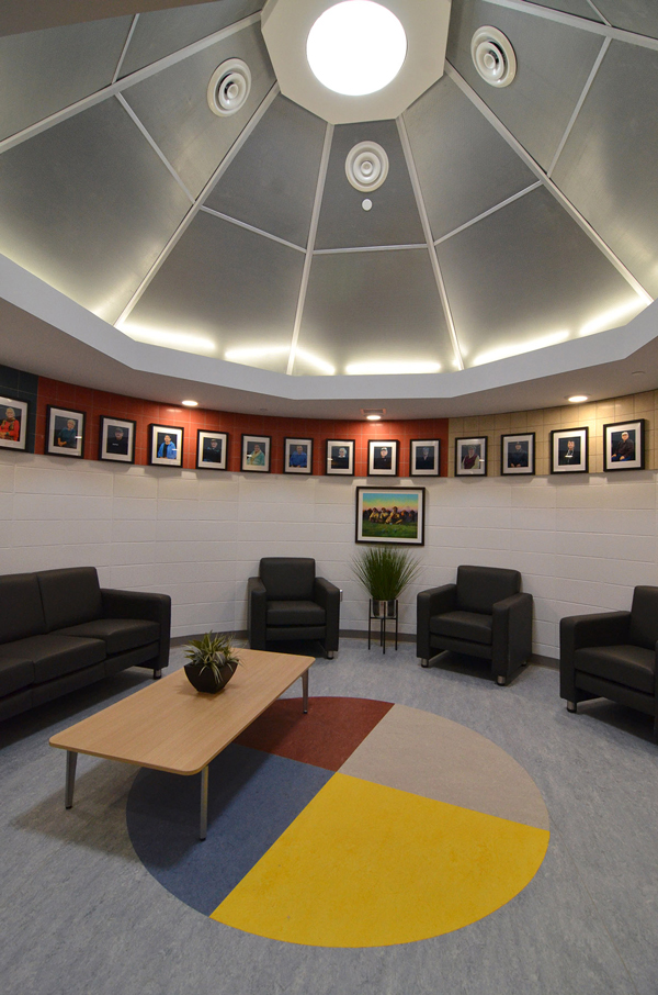 Chief Sabitawasis school, designed by architect Heney Klypak to double as a community activity centre in the evenings, features an elders' room. The use of masonry in the structure permitted a circular room design while masonry also provides an effect thermal mass and sound barrier. 