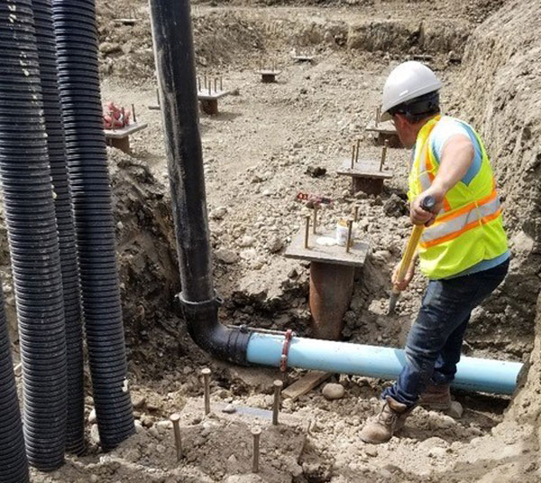 Initial work for the RCMP detachment involved installing underground infrastructure, which included pilings and grade beams, and a series of wells to support a geothermal exchange system that uses the earth's energy to heat or cool the structure.